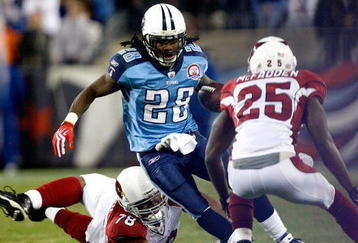 NASHVILLE, TN - NOVEMBER 29:  Teammates Alan Branch #78 and Bryant McFadden #25 of the Arizona Cardinals try to tackle Chris Johnson #28 of the Tennessee Titans during their game at LP Field on November 29, 2009 in Nashville, Tennessee.  (Photo by Streeter Lecka/Getty Images)