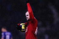 PORTSMOUTH, ENGLAND - NOVEMBER 28:  Wayne Rooney of Manchester United walks off with the match ball after his hatrick during the Barclays Premier League match between Portsmouth and Manchester United at Fratton Park on November 28, 2009 in Portsmouth, England.  (Photo by Clive Rose/Getty Images)