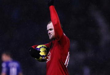 PORTSMOUTH, ENGLAND - NOVEMBER 28:  Wayne Rooney of Manchester United walks off with the match ball after his hatrick during the Barclays Premier League match between Portsmouth and Manchester United at Fratton Park on November 28, 2009 in Portsmouth, England.  (Photo by Clive Rose/Getty Images)