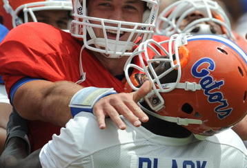 GAINESVILLE, FL - APRIL 18: Quarterback Tim Tebow #15 of the University of Florida butts heads during warmups with safety Ahmad Black #35 during the spring football Orange and Blue game April 18, 2009 at Ben Hill Griffin Stadium in Gainesville, Florida.  (Photo by Al Messerschmidt/Getty Images)