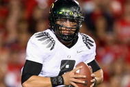 TUCSON, AZ - NOVEMBER 21:  Quarterback Jeremiah Masoli #8 of the Oregon Ducks scrambles with the ball during the college football game against the Arizona Wildcats at Arizona Stadium on November 21, 2009 in Tucson, Arizona. The Ducks defeated the Wildcats 44-41 in second overtime.  (Photo by Christian Petersen/Getty Images)