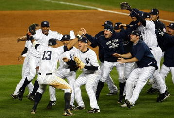 NEW YORK - NOVEMBER 04:  Mariano Rivera #42 and Mark Teixeira #25 of the New York Yankees run towards Alex Rodriguez #13 and his teammates as they celebrate after their 7-3 win against the Philadelphia Phillies in Game Six of the 2009 MLB World Series at Yankee Stadium on November 4, 2009 in the Bronx borough of New York City.  (Photo by Chris McGrath/Getty Images)