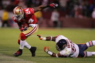 SAN FRANCISCO - NOVEMBER 12: Michael Robinson #24 of the San Francisco 49ers tries to stay in bounds as Lance Briggs #55 of the Chicago Bears dives after him at Candlestick Park on November 12, 2009 in San Francisco, California. (Photo by Ezra Shaw/Getty Images)