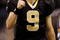 NEW ORLEANS - NOVEMBER 30: Quarterback Drew Brees #9 of the New Orleans Saints celebrates after a touchdown against the New England Patriots at Louisana Superdome on November 30, 2009 in New Orleans, Louisiana.  (Photo by Chris Graythen/Getty Images)