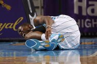 NEW ORLEANS - NOVEMBER 13:  Chris Paul #3 of the New Orleans Hornets lies on the court in pain during the game against the Portland Trail Blazers at New Orleans Arena on November 13, 2009 in New Orleans, Louisiana.  NOTE TO USER: User expressly acknowledges and agrees that, by downloading and or using this photograph, User is consenting to the terms and conditions of the Getty Images License Agreement. (Photo by Chris Graythen/Getty Images)