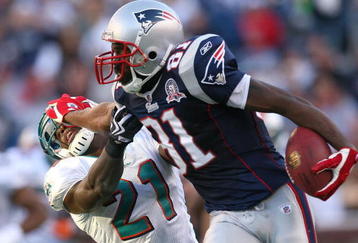 FOXBORO, MA - NOVEMBER 8:  Randy Moss #81 of the New England Patriots gains yards against the defense of Vontae Davis of the Miami Dolphins at Gillette Stadium on November 8, 2009 in Foxboro, Massachusetts. The Patriots won 27-17. (Photo by Jim Rogash/Getty Images)