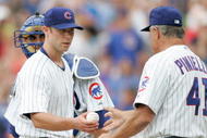 CHICAGO, IL- JULY 12:  Pitcher Rich Harden #40 of the Chicago Cubs hands the baseball to manager Lou Pinnella #41 against the San Francisco Giants at Wrigley Field on July 12, 2008 in Chicago, Illinois. (Photo by Scott Boehm/Getty Images)