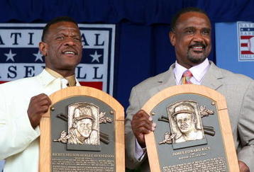 COOPERSTOWN, NY - JULY 26:  2009 inductees Rickey Henderson (L) and Jim Rice pose for a photograph with their plaques at Clark Sports Center during the Baseball Hall of Fame induction ceremony on July 26, 2009 in Cooperstown, New York. Henderson is the all-time leader in stolen bases (1,406) and runs (2,295), a ten time All-Star, was the 1990 American League most valuable player and won two World Series titles. Rice played his entire sixteen year career with the Boston Red Sox, was the 1978 American League most valuable player and was a eight time All-Star.  (Photo by Jim McIsaac/Getty Images)