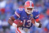 GAINESVILLE, FL - NOVEMBER 17:  Cameron Newton of the Florida Gators breaks a tackle during a  game against the FAU Owls at Ben Hill Griffin Stadium on November 17, 2007 in Gainesville, Florida.  (Photo by Sam Greenwood/Getty Images)