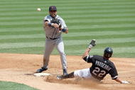 CHICAGO - JUNE 08: Placido Polanco #14 of the Detroit Tigers makes a double play as he throws to first base and tags out Scott Podsednik #22 of the Chicago White Sox on June 8, 2009 at U.S. Cellular Field in Chicago, Illinois. (Photo by Jonathan Daniel/Getty Images)