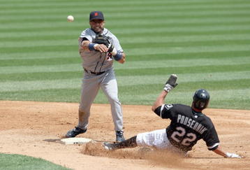 CHICAGO - JUNE 08:  Placido Polanco #14 of the Detroit Tigers makes a double play as he throws to first base and tags out Scott Podsednik #22 of the Chicago White Sox on June 8, 2009 at U.S. Cellular Field in Chicago, Illinois. (Photo by Jonathan Daniel/Getty Images) 