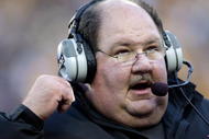 KANSAS CITY, MO - NOVEMBER 28:  Head coach Mark Mangino of the Kansas Jayhawks watches from the sidelines during the game against the Missouri Tigers at Arrowhead Stadium on November 28, 2009 in Kansas City, Missouri.  (Photo by Jamie Squire/Getty Images)