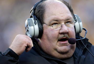 KANSAS CITY, MO - NOVEMBER 28:  Head coach Mark Mangino of the Kansas Jayhawks watches from the sidelines during the game against the Missouri Tigers at Arrowhead Stadium on November 28, 2009 in Kansas City, Missouri.  (Photo by Jamie Squire/Getty Images)