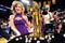 LOS ANGELES, CA - OCTOBER 27:  A member of the Laker Girls poses with the Larry O'Brien championship trophy and rings to be presented to the Los Angeles Lakers before the season opening game against the Los Angeles Clippers at Staples Center on October 27, 2009 in Los Angeles, California.  NOTE TO USER: User expressly acknowledges and agrees that, by downloading and or using this photograph, User is consenting to the terms and conditions of the Getty Images License Agreement. Mandatory Copyright Notice: Copyright 2009 NBAE  (Photo by Kevork Djansezian/Getty Images)
