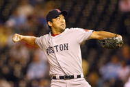 KANSAS CITY, MO - SEPTEMBER 24: Pitcher Takashi Saito #24 of the Boston Red Sox pitches during the game against the Kansas City Royals on September 24, 2009 at Kauffman Stadium in Kansas City, Missouri. (Photo by Jamie Squire/Getty Images)