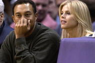 LOS ANGELES - FEBRUARY 18:  Golfer Tiger Woods and girlfriend Elin Nordegren attend the game between the Los Angeles Lakers and the Houston Rockets on February 18, 2003 at Staples Center in Los Angeles, Caifornia. (Photo by Vince Bucci/Getty Images)