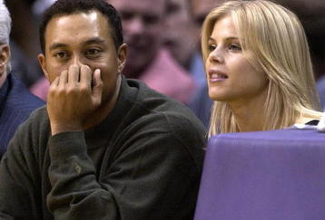 LOS ANGELES - FEBRUARY 18:  Golfer Tiger Woods and girlfriend Elin Nordegren attend the game between the Los Angeles Lakers and the Houston Rockets on February 18, 2003 at Staples Center in Los Angeles, Caifornia. (Photo by Vince Bucci/Getty Images)