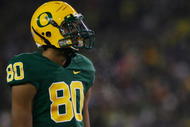 EUGENE,OR - DECEMBER 03:  Lavasier Tuinei #80 of the Oregon Ducks watches the game against the Oregon State Beavers at Autzen Stadium on December 3, 2009 in Eugene, Oregon. (Photo by Tom Hauck/Getty Images)