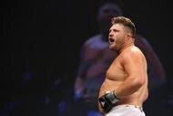 UNCASVILLE, CT - MAY 16: Roy Nelson (White Trunks) of the Lions Den celebrates after beating Brad Imes MilesTech Fighting System during their bout presented by the International Fighting League at the Mohegan Sun Arena May 16, 2008 in Uncasville, Connecticut.  (Photo by Al Bello/Getty Images)