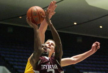 ANAHEIM, CA - NOVEMBER 29:  Derrick Roland #3 of Texas A&M puts up a short  jump shot past Colton Iverson #45 of Minnesota in the first half during the 76 Classic at Anaheim Convention Center on November 29, 2009 in Anaheim, California.  (Photo by Victor Decolongon/Getty Images)