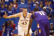 LAWRENCE, KS - NOVEMBER 27:  Cole Aldrich #45 of the Kansas Jayhawks guards Terrell Barnes #11 of the Tennessee Tech Golden Eagles during the game on November 27, 2009 at Allen Fieldhouse in Lawrence, Kansas. (Photo by Jamie Squire/Getty Images)