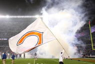 CHICAGO - NOVEMBER 22: A worker waves a Chicago Bear flag during player introductions before a game between the Bears and the Philadelphia Eagles at Soldier Field on November 22, 2009 in Chicago, Illinois. The Eagles defeated the Bears 24-20. (Photo by Jonathan Daniel/Getty Images)