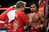 LAS VEGAS - NOVEMBER 14:  Manny Pacquiao sits in his corner between rounds with trainer Freddie Roach against Miguel Cotto during their WBO welterweight title fight at the MGM Grand Garden Arena on November 14, 2009 in Las Vegas, Nevada.  (Photo by Al Bello/Getty Images)