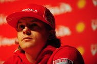 SAO PAULO, BRAZIL - OCTOBER 15:  Kimi Raikkonen of Finland and Ferrari talks at a press conference during previews to the Brazilian Formula One Grand Prix on October 15, 2009 in Sao Paulo, Brazil.  (Photo by Clive Mason/Getty Images)