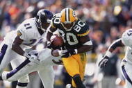 14 Oct 2001: Donald Driver #80 of the Green Bay Packers gets tackled by Chris McAllister #21 and James Trapp #38 of the Baltimore Ravens during the game at Lambeau Field in Green Bay, Wisconsin. The Packers defeated the Ravens 31-23.Mandatory Credit: Harry How /Allsport