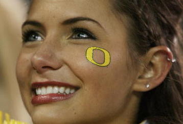 EUGENE,OR - DECEMBER 03: An Oregon Ducks cheerleader smiles after her team's 33-37 victory over the Oregon State Beavers at Autzen Stadium on December 3, 2009 in Eugene, Oregon. (Photo by Tom Hauck/Getty Images)