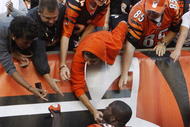 CINCINNATI - NOVEMBER 8: Chad Ochocinco #85 of the Cincinnati Bengals celebrates with his fans after defeating the Baltimore Ravens 17-7 at Paul Brown Stadium on November 8, 2009 in Cincinnati, Ohio.  (Photo by John Sommers II/Getty Images)