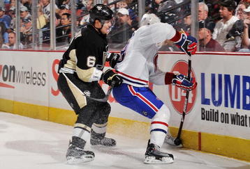 PITTSBURGH - NOVEMBER 25:  Defenseman Ben Lovejoy #6 finishes a check on forward Kyle Chipchura #28 of the Montreal Canadiens on November 25, 2009 at Mellon Arena in Pittsburgh, Pennsylvania.  (Photo by Jamie Sabau/Getty Images)