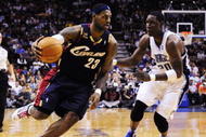 ORLANDO, FL - NOVEMBER 11:  LeBron James #23 of the Cleveland Cavaliers drives against Mickael Pietrus #20 of the Orlando Magic during the game on November 11, 2009 at Amway Arena in Orlando, Florida. NOTE TO USER: User expressly acknowledges and agrees that, by downloading and/or using this Photograph, user is consenting to the terms and conditions of the Getty Images License Agreement. (Photo by Sam Greenwood/Getty Images)