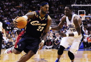 ORLANDO, FL - NOVEMBER 11:  LeBron James #23 of the Cleveland Cavaliers drives against Mickael Pietrus #20 of the Orlando Magic during the game on November 11, 2009 at Amway Arena in Orlando, Florida. NOTE TO USER: User expressly acknowledges and agrees that, by downloading and/or using this Photograph, user is consenting to the terms and conditions of the Getty Images License Agreement. (Photo by Sam Greenwood/Getty Images)