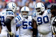HOUSTON - NOVEMBER 29: Defensive tackles Antonio Johnson #99 and Daniel Muir #90 chat with linebacker Ramon Humber #59 of the Indianapolis Colts chat during a time out against the Houston Texans at Reliant Stadium on November 29, 2009 in Houston, Texas.  (Photo by Bob Levey/Getty Images)