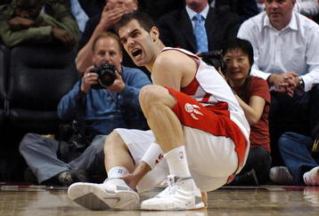 TORONTO- MAY 1:  Jose Calderon #8 of the Toronto Raptors goes down with an ankle injury late in Game Five of the Eastern Conference Quarterfinals during the 2007 NBA Playoffs at Air Canada Centre on May 1, 2007 in Toronto, Ontario, Canada . Raptors win 98-96. NOTE TO USER: User expressly acknowledges and agrees that, by downloading and or using this photograph, User is consenting to the terms and conditions of the Getty Images License Agreement. (Photo by Graig Abel/Getty Images)