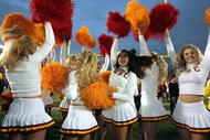 PASADENA, CA - DECEMBER 4:  USC Trojans cheerleaders celebrate the team's 29-24 victory over the UCLA Bruins on December 4, 2004 at the Rose Bowl in Pasadena, California (Photo by Jeff Gross/Getty Images)