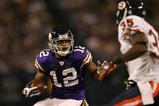MINNEAPOLIS - NOVEMBER 29:  Percy Harvin #12 of the Minnesota Vikings carries the ball as Zackary Bowman #35 of the Chicago Bears defends on November 29, 2009 at Hubert H. Humphrey Metrodome in Minneapolis, Minnesota. The Vikings defeated the Bears 36-10.  (Photo by Elsa/Getty Images)