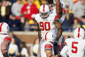 ANN ARBOR, MI - NOVEMBER 21: Thaddeus Gibson #90 of the Ohio State Buckeyes celebrates a fourth quarter interception with teammates while playing the Michigan Wolverines on November 21, 2009 at Michigan Stadium in Ann Arbor, Michigan. Ohio State won the game 21-10. (Photo by Gregory Shamus/Getty Images)