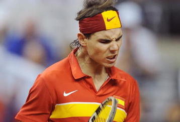 BARCELONA, SPAIN - DECEMBER 04: Rafael Nadal of Spain celebrates after winning a point against Tomas Berdych of Czech Republic during the first match of the Davis Cup final at the Palau Sant Jordi stadium on December 4, 2009 in Barcelona, Spain.  (Photo by Denis Doyle/Getty Images)