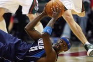 MILWAUKEE - NOVEMBER 16: Jason Terry #31 of the Dallas Mavericks looks for a teammate to pass to after slipping on the floor as Luke Ridnour #13 of the Milwaukee Bucks closes in at the Bradley Center on November 16, 2009 in Milwaukee, Wisconsin. The Mavericks defeated the Bucks 115-113 in overtime. (Photo by Jonathan Daniel/Getty Images)