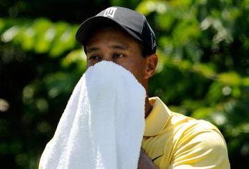 PONTE VEDRA BEACH, FL - MAY 08:  Tiger Woods dries his face before playing his tee shot on the fifth hole during the second round of THE PLAYERS Championship on THE PLAYERS Stadium Course at TPC Sawgrass on May 8, 2009 in Ponte Vedra Beach, Florida.  (Photo by Sam Greenwood/Getty Images)