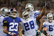 ARLINGTON, TX - SEPTEMBER 20:  Running back Felix Jones #28 of the Dallas Cowboys celebrates his touchown in front of Corey Webster #23 of the New York Giants at Cowboys Stadium on September 20, 2009 in Arlington, Texas.  (Photo by Ronald Martinez/Getty Images)