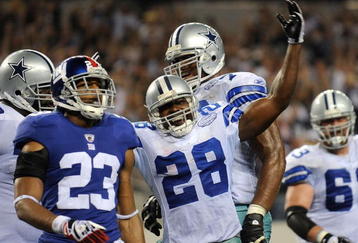 ARLINGTON, TX - SEPTEMBER 20:  Running back Felix Jones #28 of the Dallas Cowboys celebrates his touchown in front of Corey Webster #23 of the New York Giants at Cowboys Stadium on September 20, 2009 in Arlington, Texas.  (Photo by Ronald Martinez/Getty Images)