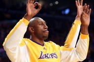 LOS ANGELES, CA - MAY 12:  DJ Mbenga #28 of the Los Angeles Lakers reacts from the bench against the Houston Rockets in Game Five of the Western Conference Semifinals during the 2009 NBA Playoffs at Staples Center on May 12, 2009 in Los Angeles, California. NOTE TO USER: User expressly acknowledges and agrees that, by downloading and or using this photograph, User is consenting to the terms and conditions of the Getty Images License Agreement.  (Photo by Stephen Dunn/Getty Images)