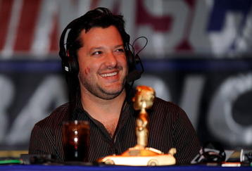 LAS VEGAS - DECEMBER 03:  Driver Tony Stewart smiles during the The Stewies on SIRIUS NASCAR Radio during NASCAR Sprint Cup Series Champions Week on December 3, 2009 in Las Vegas, Nevada.  (Photo by Rusty Jarrett/Getty Images for NASCAR)