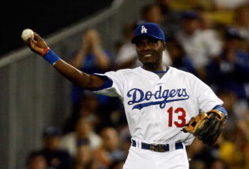 LOS ANGELES, CA - OCTOBER 03: Orlando Hudson #13 of the Los Angeles Dodgers throws the ball to third base after a play while playing against the Colorado Rockies during the game at Dodger Stadium on October 3, 2009 in Los Angeles, California.  (Photo by Jacob de Golish/Getty Images)
