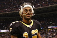 NEW ORLEANS - NOVEMBER 30: Marques Colston #12 of the New Orleans Saints smiles as he walks off the field after their 38-17 win against the New England Patriots  at Louisana Superdome on November 30, 2009 in New Orleans, Louisiana. (Photo by Scott Halleran/Getty Images)