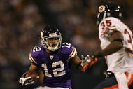 MINNEAPOLIS - NOVEMBER 29: Percy Harvin #12 of the Minnesota Vikings carries the ball as Zackary Bowman #35 of the Chicago Bears defends on November 29, 2009 at Hubert H. Humphrey Metrodome in Minneapolis, Minnesota. The Vikings defeated the Bears 36-10. (Photo by Elsa/Getty Images)