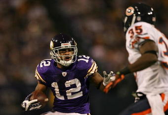 MINNEAPOLIS - NOVEMBER 29:  Percy Harvin #12 of the Minnesota Vikings carries the ball as Zackary Bowman #35 of the Chicago Bears defends on November 29, 2009 at Hubert H. Humphrey Metrodome in Minneapolis, Minnesota. The Vikings defeated the Bears 36-10.  (Photo by Elsa/Getty Images)